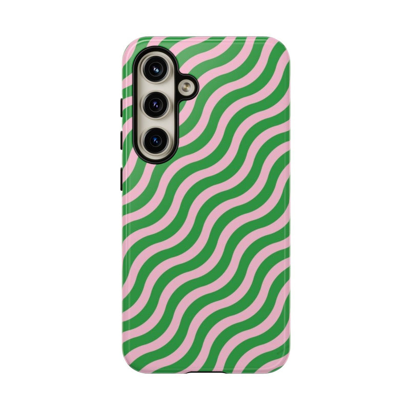 Phone case with green and pink wavy pattern on a white background